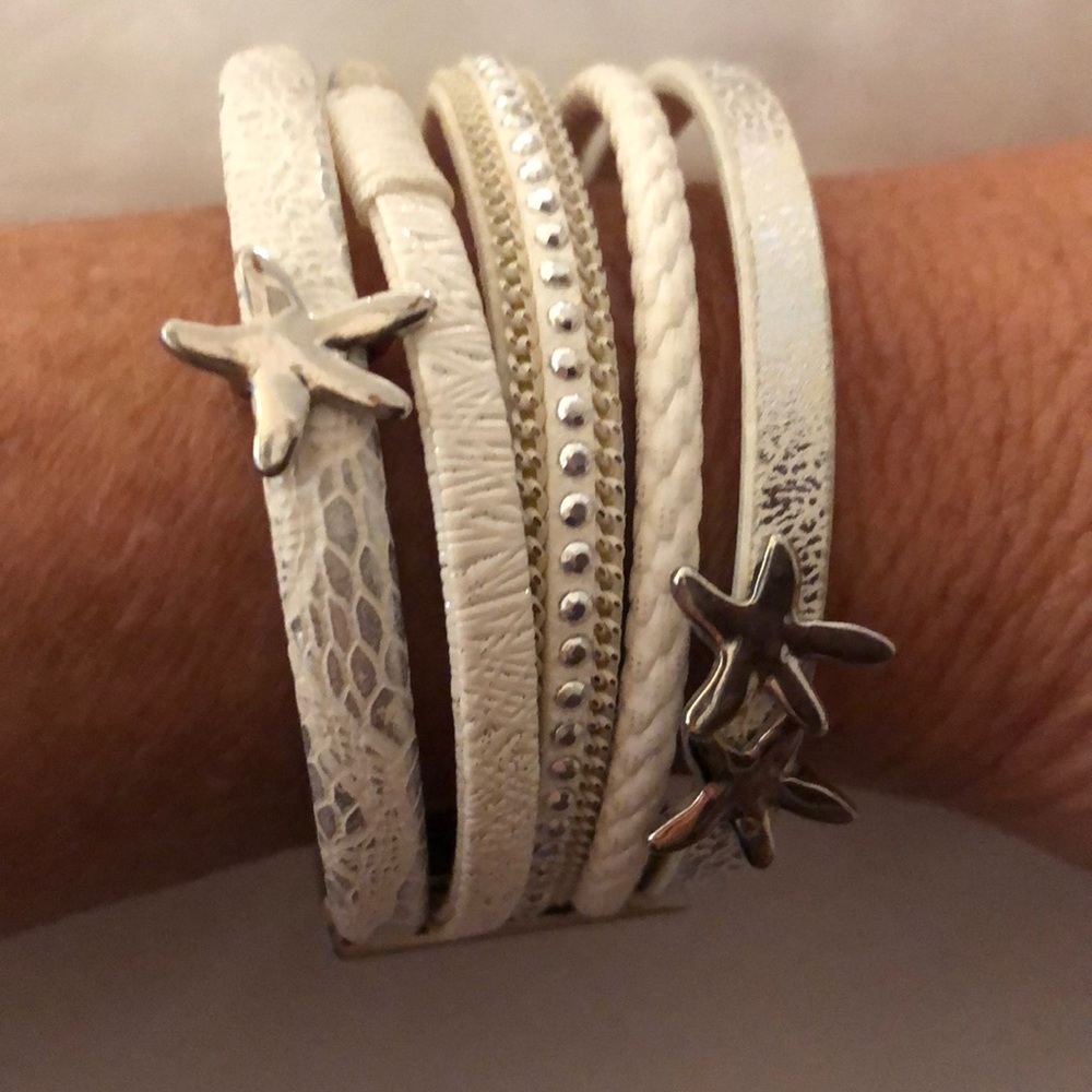 Five bracelets in one, white with silver starfish